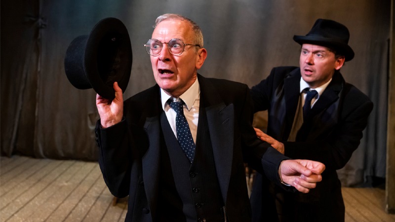 woman in black kipps and actor